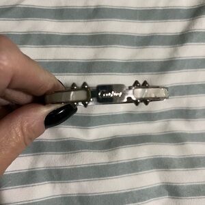 Designer inspired Silver-tone bangle w faux mother of pearl inlay.